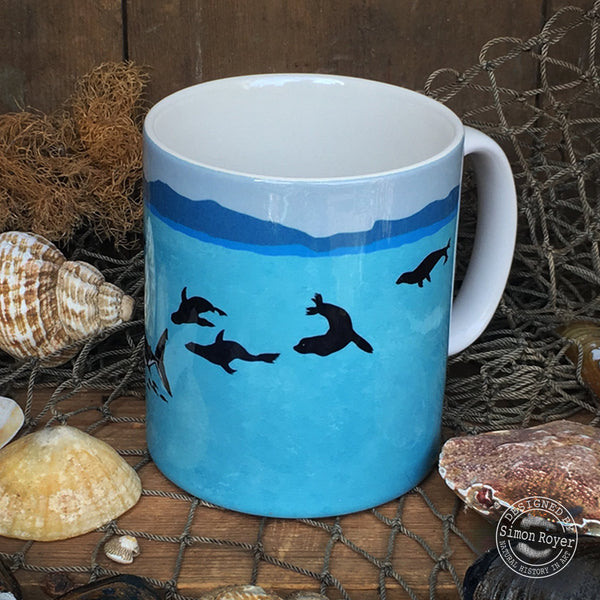 'Great White Shark and Fur Seals Ceramic Mug by simon royer.'