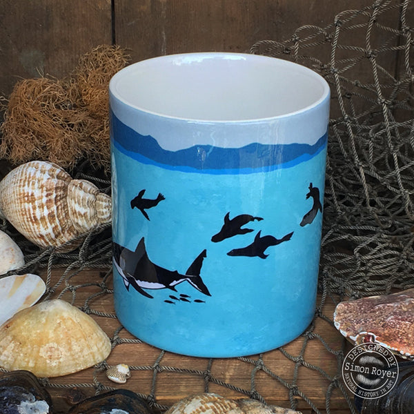 'Great White Shark and Fur Seals Ceramic Mug by simon royer.'