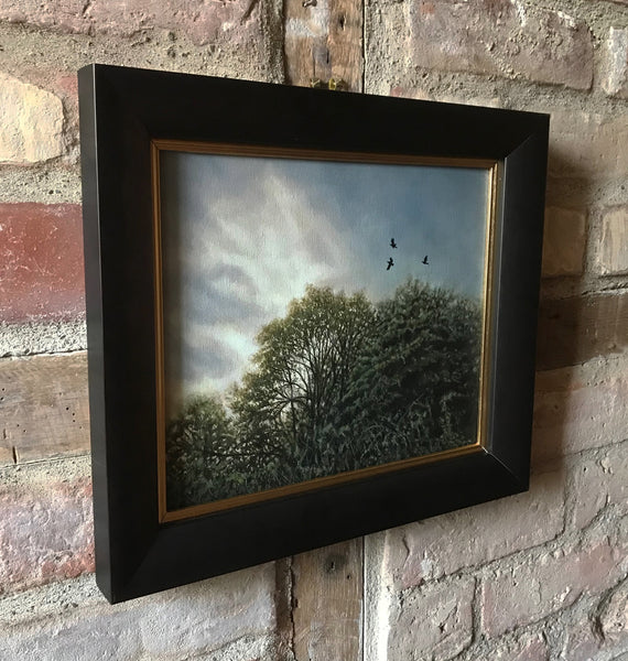 Framed oil painting of Crows above the trees by artist simon royer.